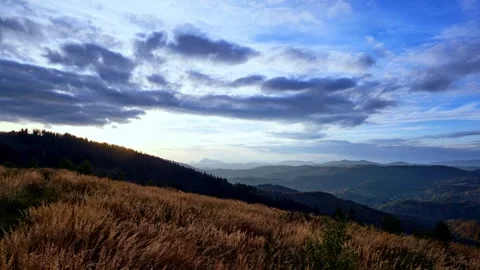 Sunset, sunlight illuminates dry grass, autumn hilly landscape, timelapse Stock-Footage 294595138