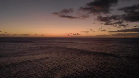 Sunset sunlight over ocean aerial drone flying Stock Footage 99614387