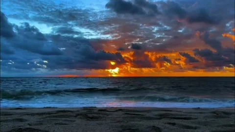 Sunset on a sunny beach Video stock 219594629