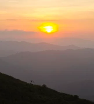 Sunset / sunrise with clouds, light rays and other atmospheric effect Stock Photos