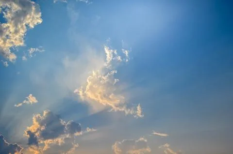 Sunset / sunrise with clouds, light rays Stock Photos
