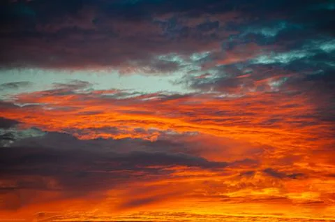 Sunset sunrise with clouds, light rays and other atmospheric effect Stock Photos