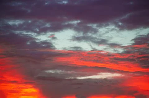 Sunset sunrise with clouds, light rays and other atmospheric effect Stock Photos