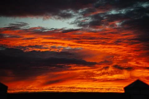 Sunset sunrise with clouds, light rays and other atmospheric effect Stock Photos