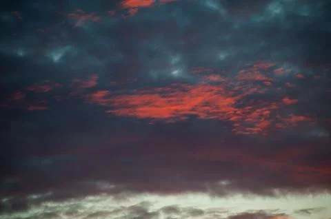 Sunset sunrise with clouds, light rays and other atmospheric effect Stock Photos