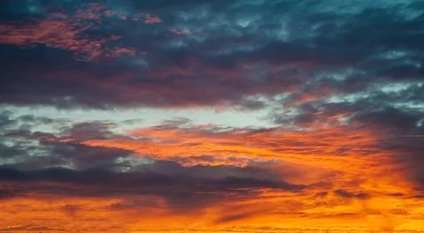 Sunset sunrise with clouds, light rays and other atmospheric effect Stock Photos