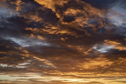 Sunset / sunrise dramatic sky with dark clouds with atmospheric effect Stock Photos