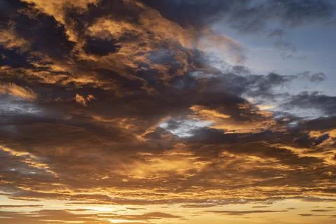 Sunset / sunrise dramatic sky with dark clouds with atmospheric effect Stock Photos