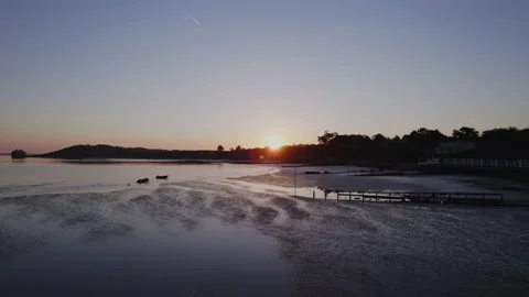 Sunset Sunrise over beach with plane flying above in the blue sky Stock Footage 167770329