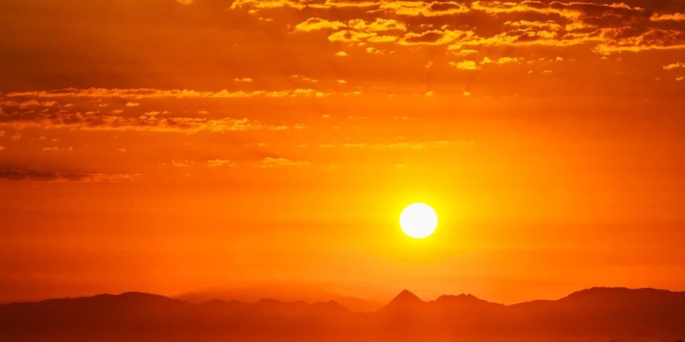 Sunset Sunrise Over Dark Mountain Silhouette. Sunshine Dramatic Stock Photos