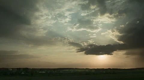 The sunset (sunrise) with rainy clouds, wide angle view. Time lapse Stock Footage 49650013