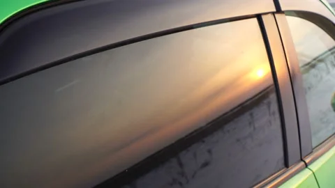 Sunset sunrise reflection in car window. Beautiful sunset at winter field 4k Stock Footage 89601783