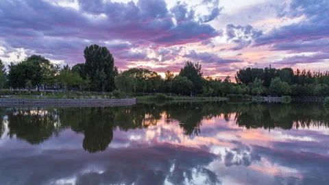 Sunset sunset glow lake reflection park Stock Footage 243728563