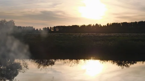 Sunset - sunset in the sky and its reflection in the watery surface of the river Stock Footage 90966813