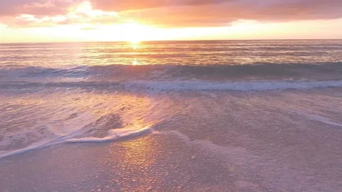 Sunset surf lapping walk on the beach Stock Footage 86864291