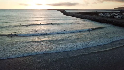 Sunset Surfing 4k Drone Stock Footage 147440312