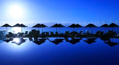 Sunset in a swimming pool Stock Photos