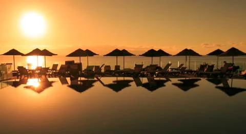 Sunset in a swimming pool Stock Photos