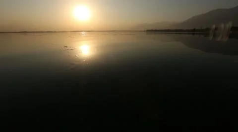 Sunset on the swimming water Stock Footage 63992348