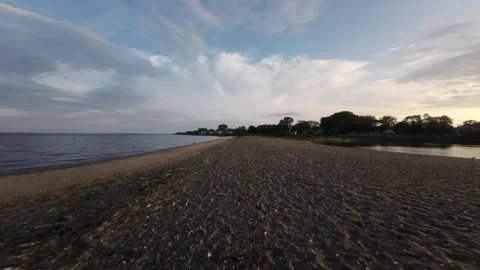 Sunset Symphony: FPV Aerial Drone Showcasing Rhode Island's Beach and Marsh Stock Footage 243823966