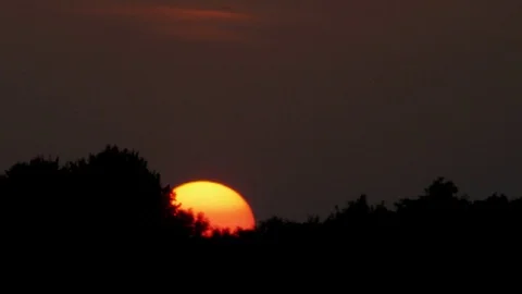 Sunset teleshot - sundown time lapse Stock Footage 72491131