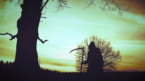 At sunset there is a grim Reaper Stock Footage 94500310