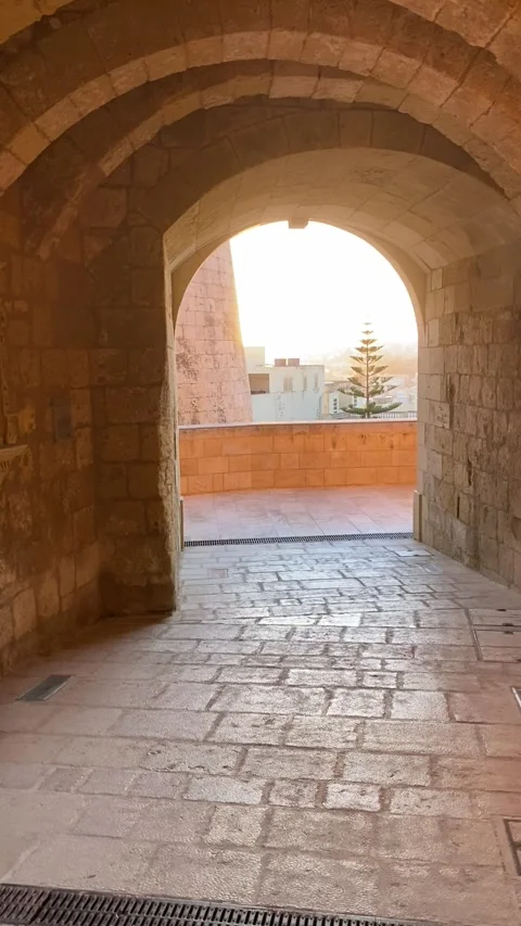 Sunset through the arched window of the Citadella in Victoria Gozo Malta Stock Footage 308461183