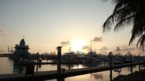 Sunset through boat masts and flying bridges at the marina Stock Footage 39246483