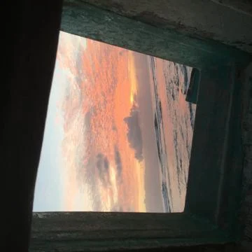 Sunset through boat window Stock Photos