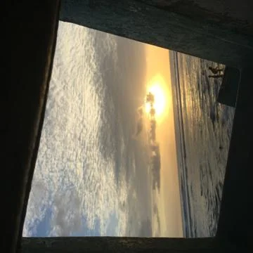 Sunset through boat window Stock Photos