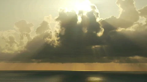 Sunset through clouds and over ocean. Stock Footage 375372