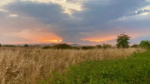 Sunset through the clouds looks like two eyes. Impressionable landscape Stock Footage 251951688