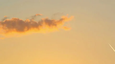 Sunset through the clouds. The movement of the camera by the sunset sky. Stock Footage 40738510