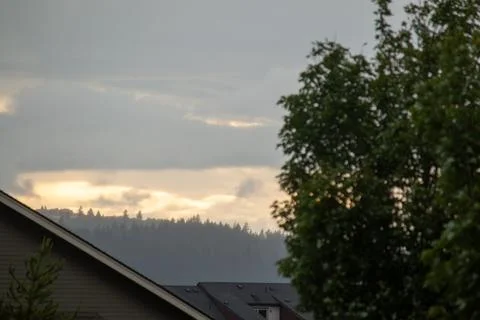 Sunset through the clouds Stock Photos