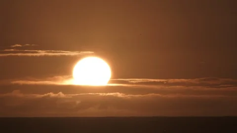 Sunset Through Cloudy Ocean Horizon Time Lapse Video stock 87261178