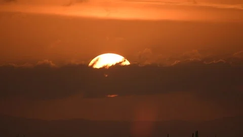 The sunset Through large clouds Video stock 124675593