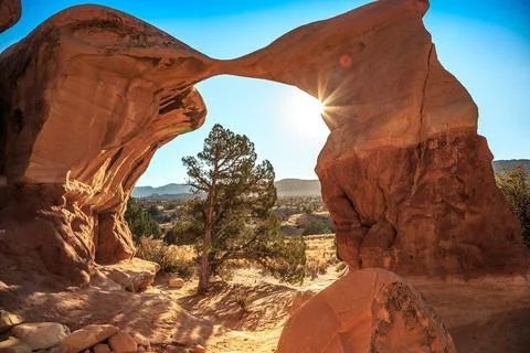 Sunset through Metate Arch at Devil's Garden, Hole in the Wall Road, Grand Stock Photos