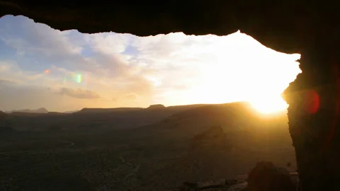 Sunset Through Rocks 4k Stock Footage 138280996