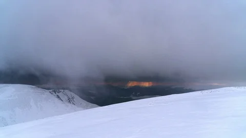 Sunset through the snow storm in the winter mountains time lapse Stock Footage 101610920