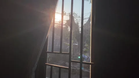 Sunset through window Video stock 343357534