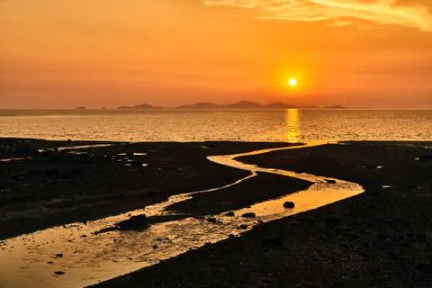Sunset with tideland Stock Photos