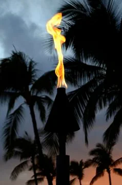 Sunset tiki torch Stock Photos