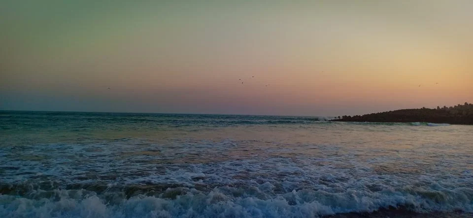 Sunset time at the beach Stock Photos
