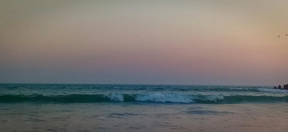 Sunset time at the beach Stock Photos
