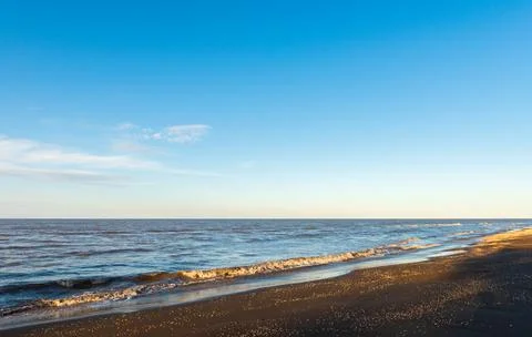 Sunset time on an empty beach Stock Photos