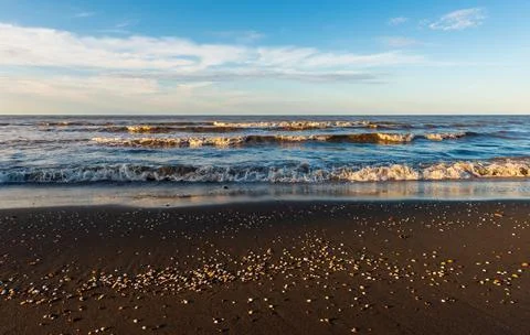 Sunset time on an empty beach Stock Photos