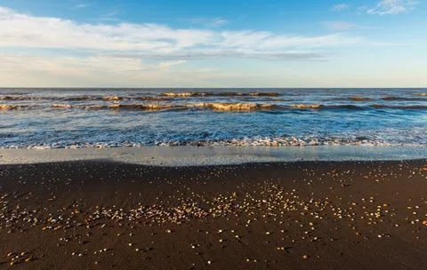 Sunset time on an empty beach Stock Photos