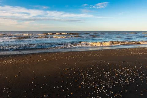 Sunset time on an empty beach Stock Photos