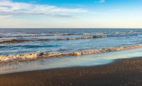 Sunset time on an empty beach Stock Photos