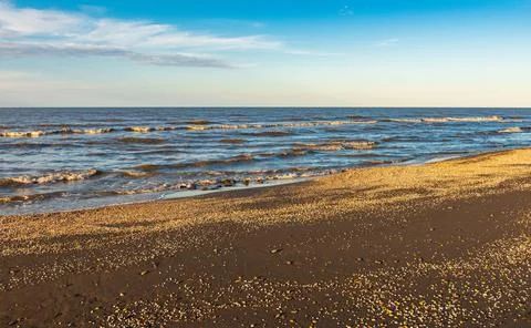 Sunset time on an empty beach Stock Photos